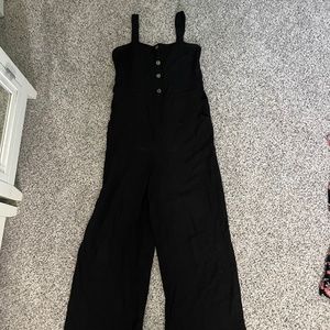 Black jumpsuit with button details on front